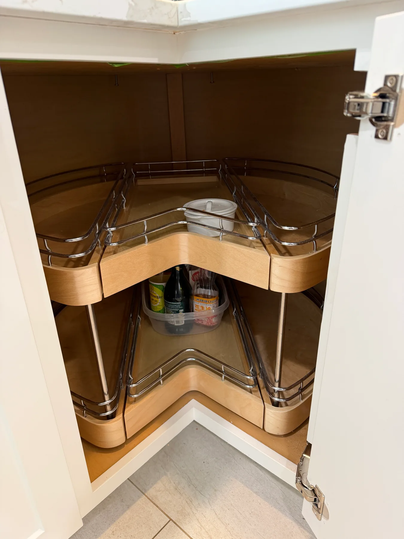 Blind-corner cabinet with rotating wire storage organizers